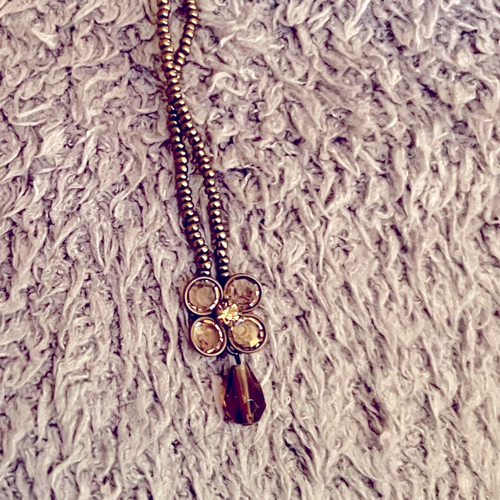 Tiny bronze bead necklace with pendant.